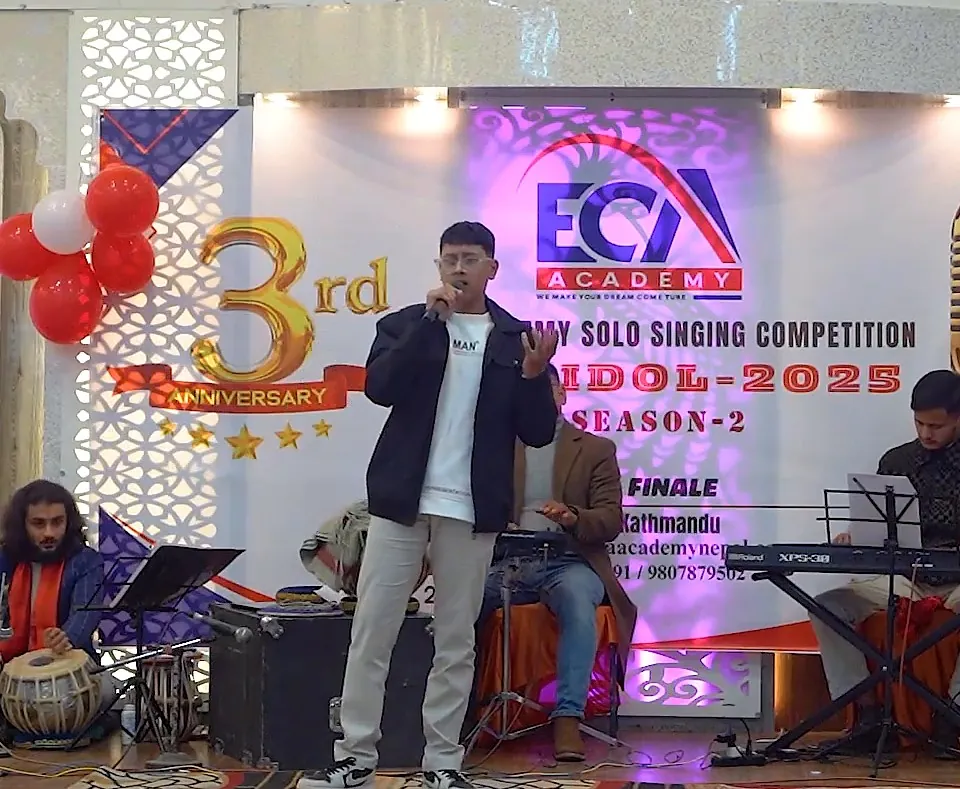 Binamra Subedi singing with the ECA band