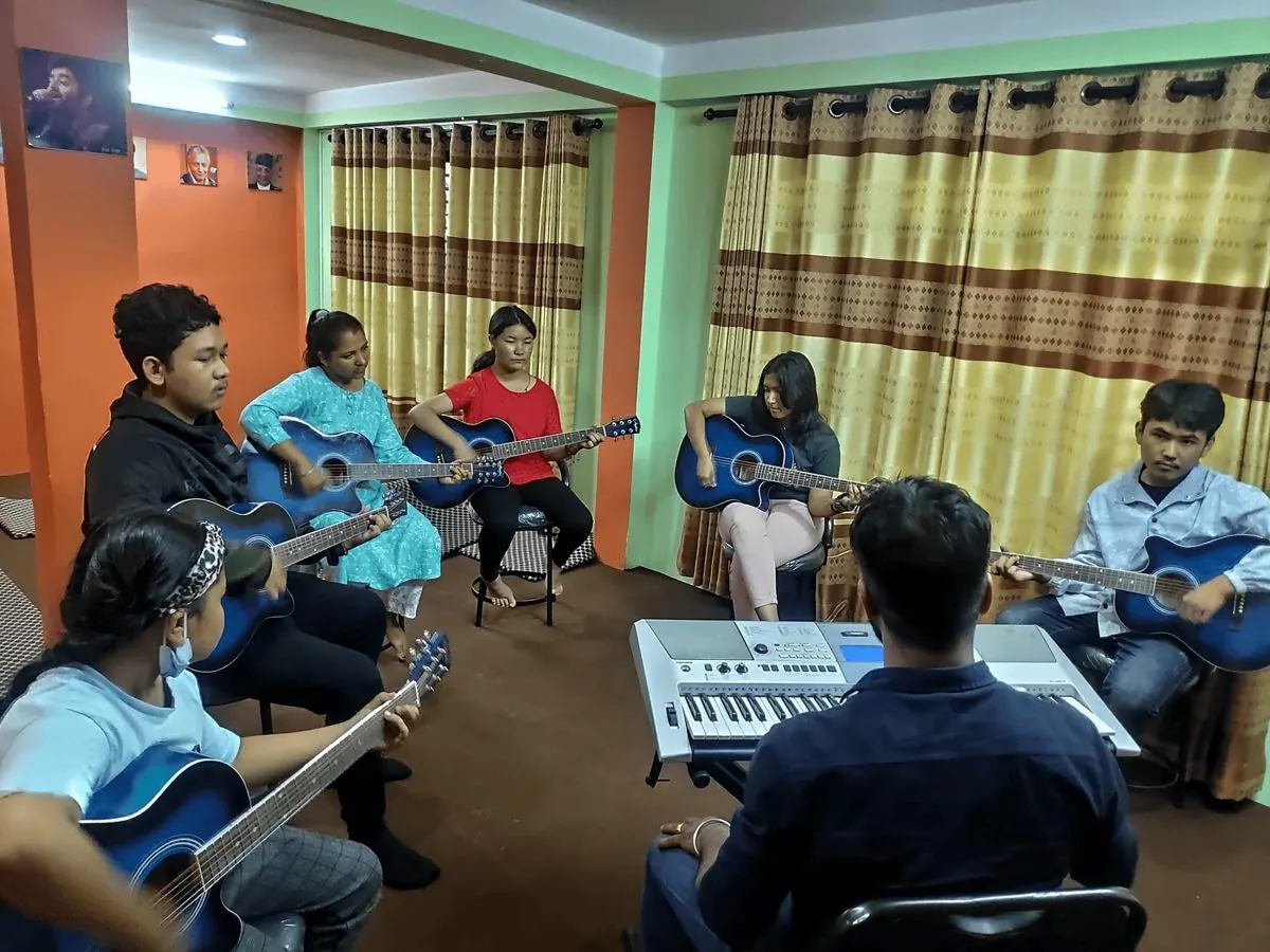An early guitar class at ECA Academy